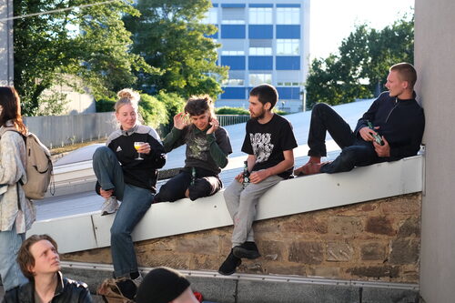 Participants relaxing together on a rooftop during the exchange